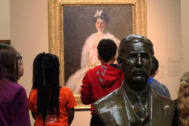 Image of woman pouring beer from a keg